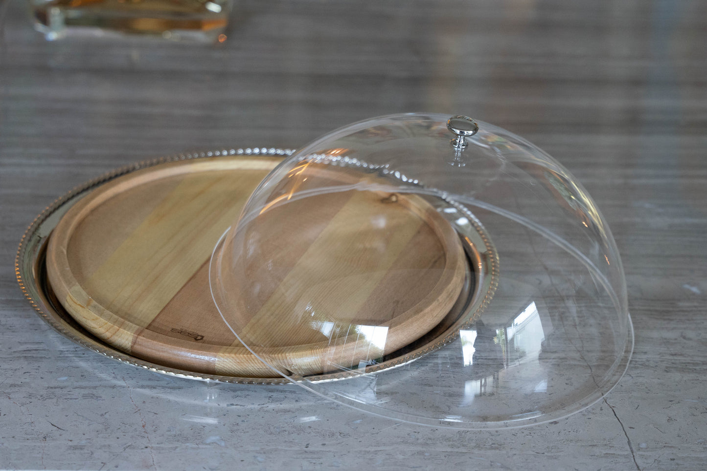 Silver round plate with wood board insert perfect for cheese and cake with plexiglass cover