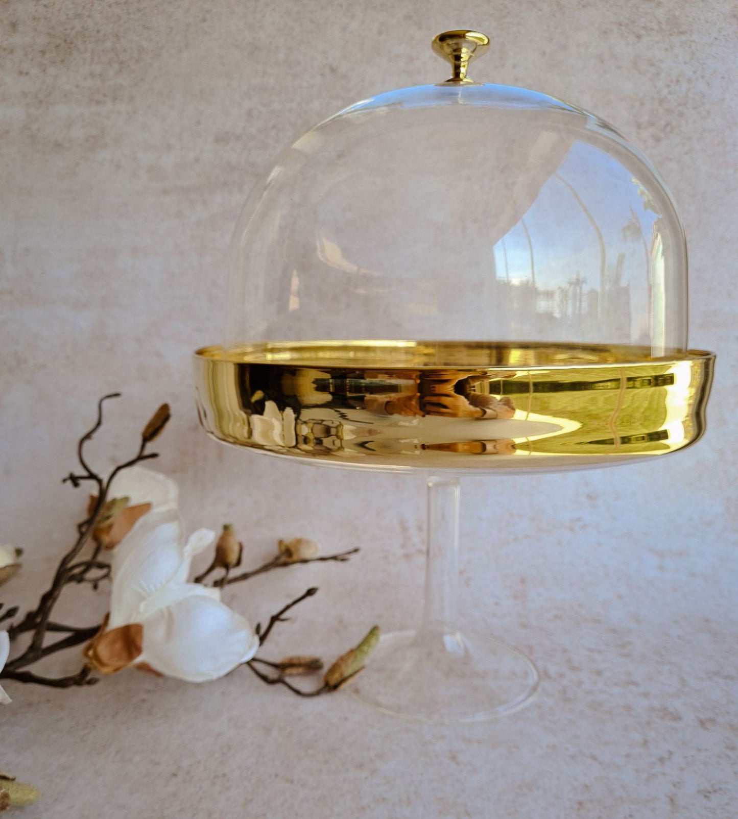 Blown glass cake plate with cover with gold rim.