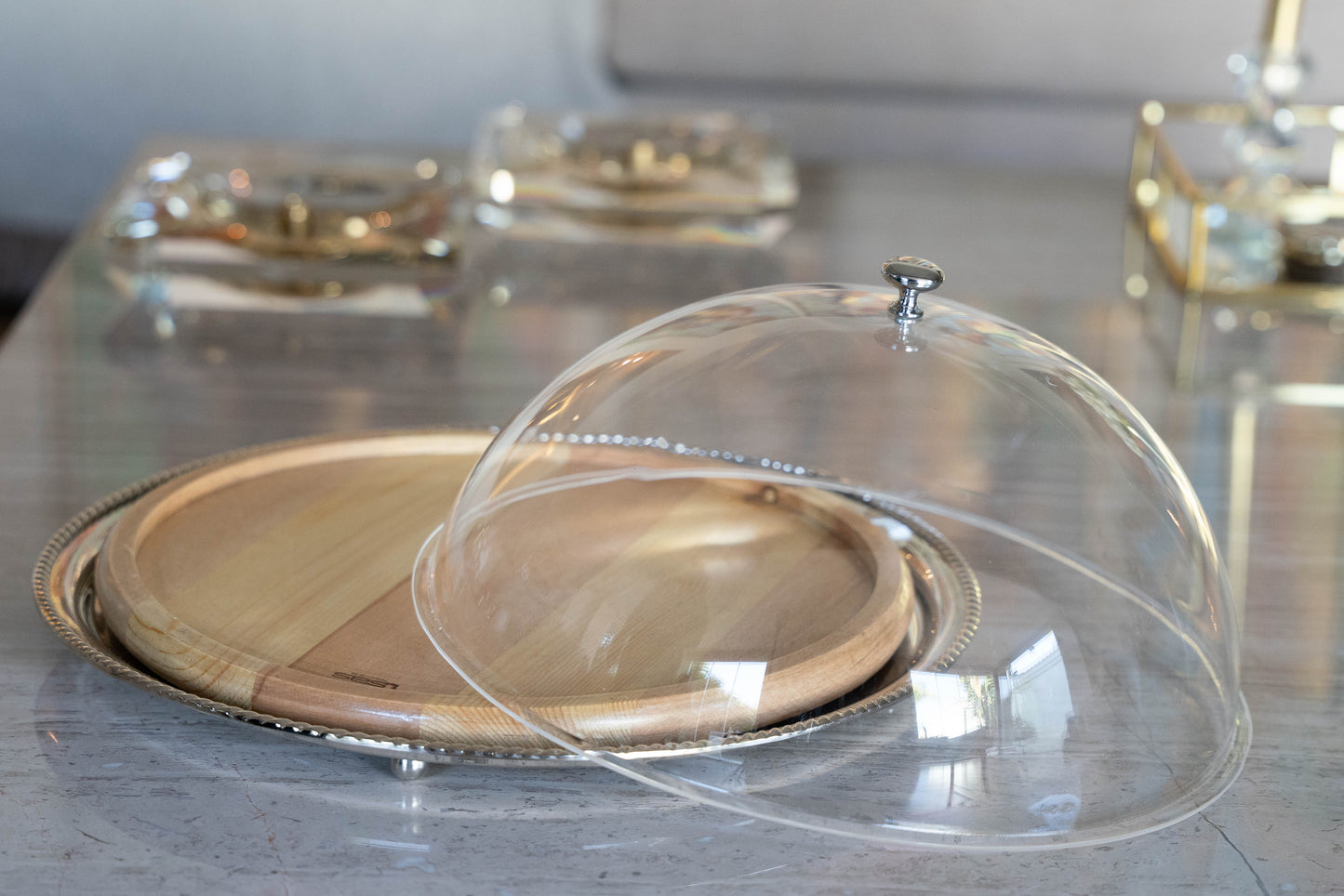 Silver round plate with wood board insert perfect for cheese and cake with plexiglass cover
