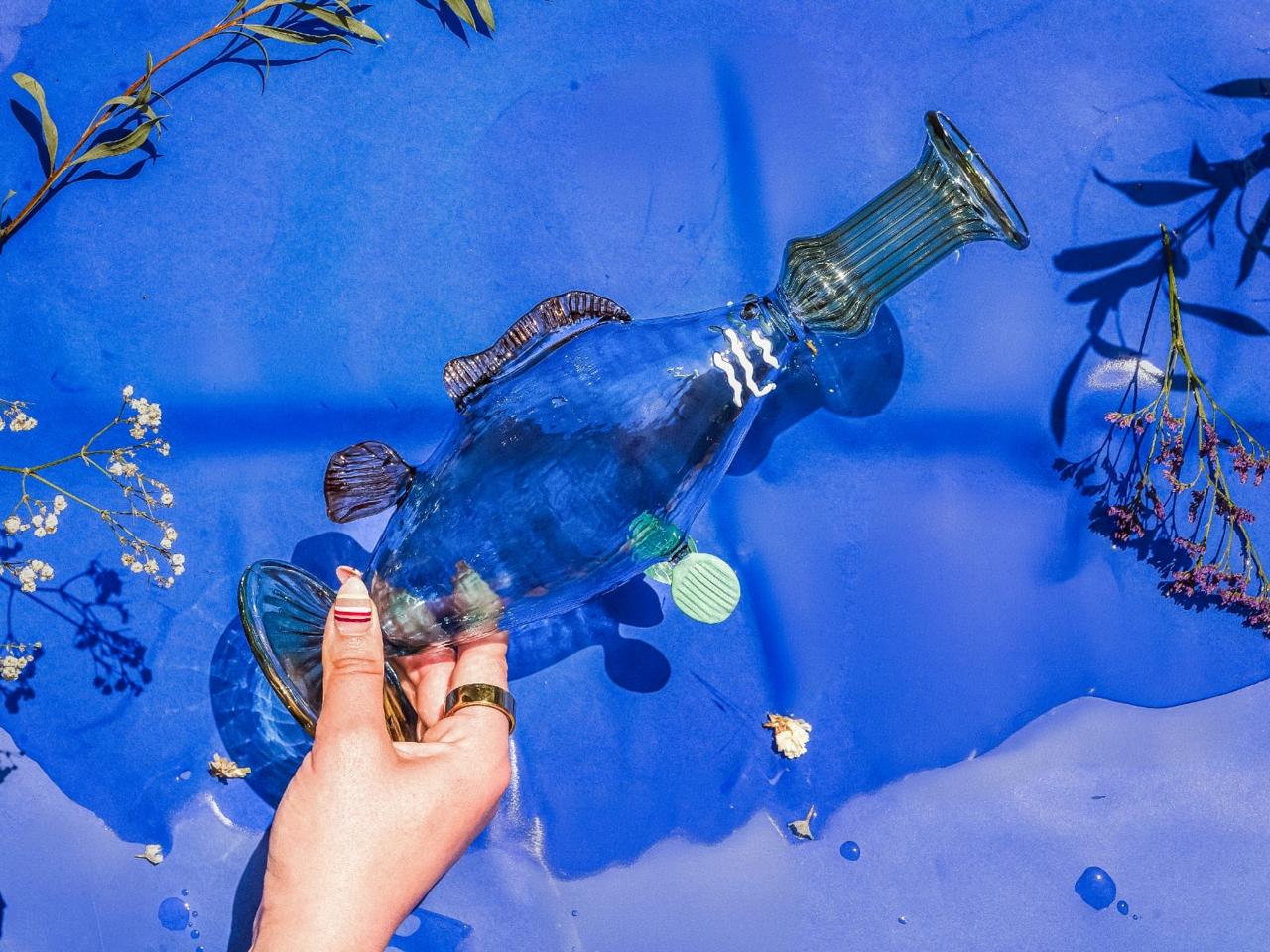 Glass fish candle holder